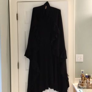 Gorgeous soft versatile wrap with ruffled edges.